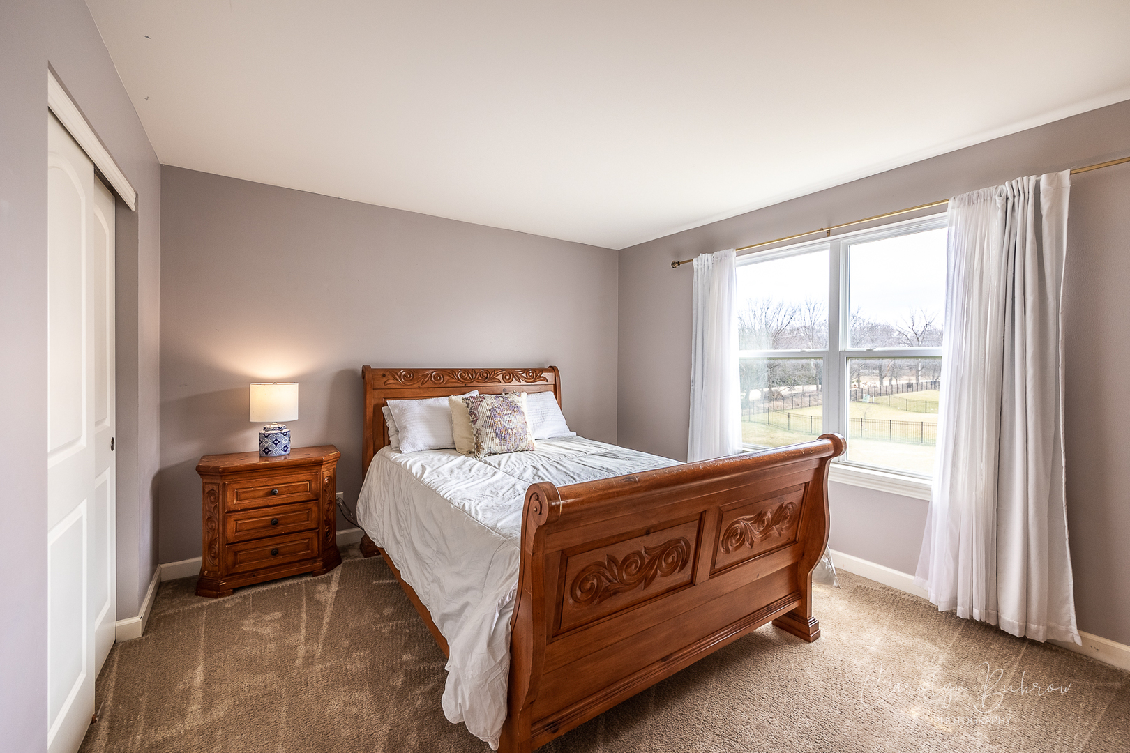 4354 Rudyard Kipling Road Elgin, IL 60124 - Photo 14 of 23 a bedroom with a bed and a large window