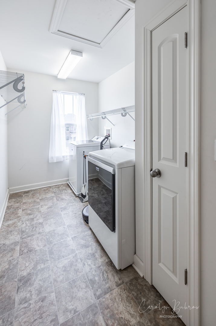 4354 Rudyard Kipling Road Elgin, IL 60124 - Photo 17 of 23 a view of utility room with washer and dryer