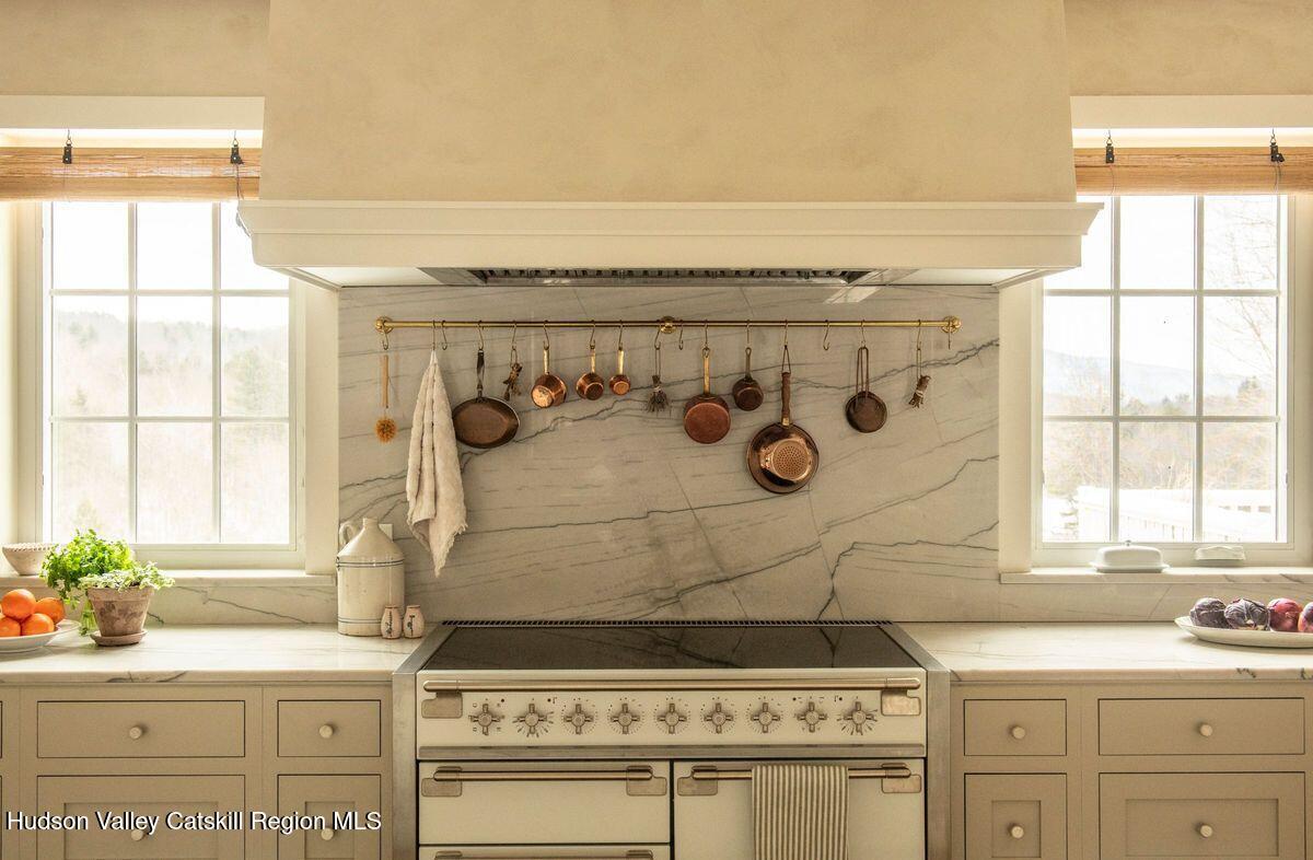 1174 Potter Mountain Road Gilboa, NY 12076 - Photo 12 of 33 a bathroom with a stove a sink and a window