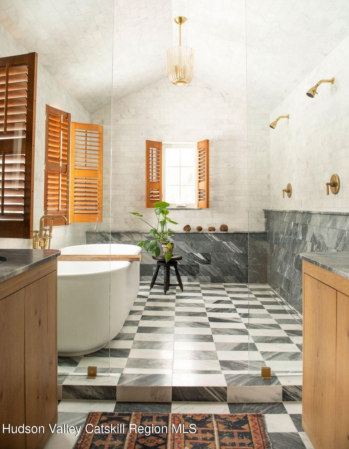 1174 Potter Mountain Road Gilboa, NY 12076 - Photo 17 of 33 a spacious bathroom with a bathtub and sink
