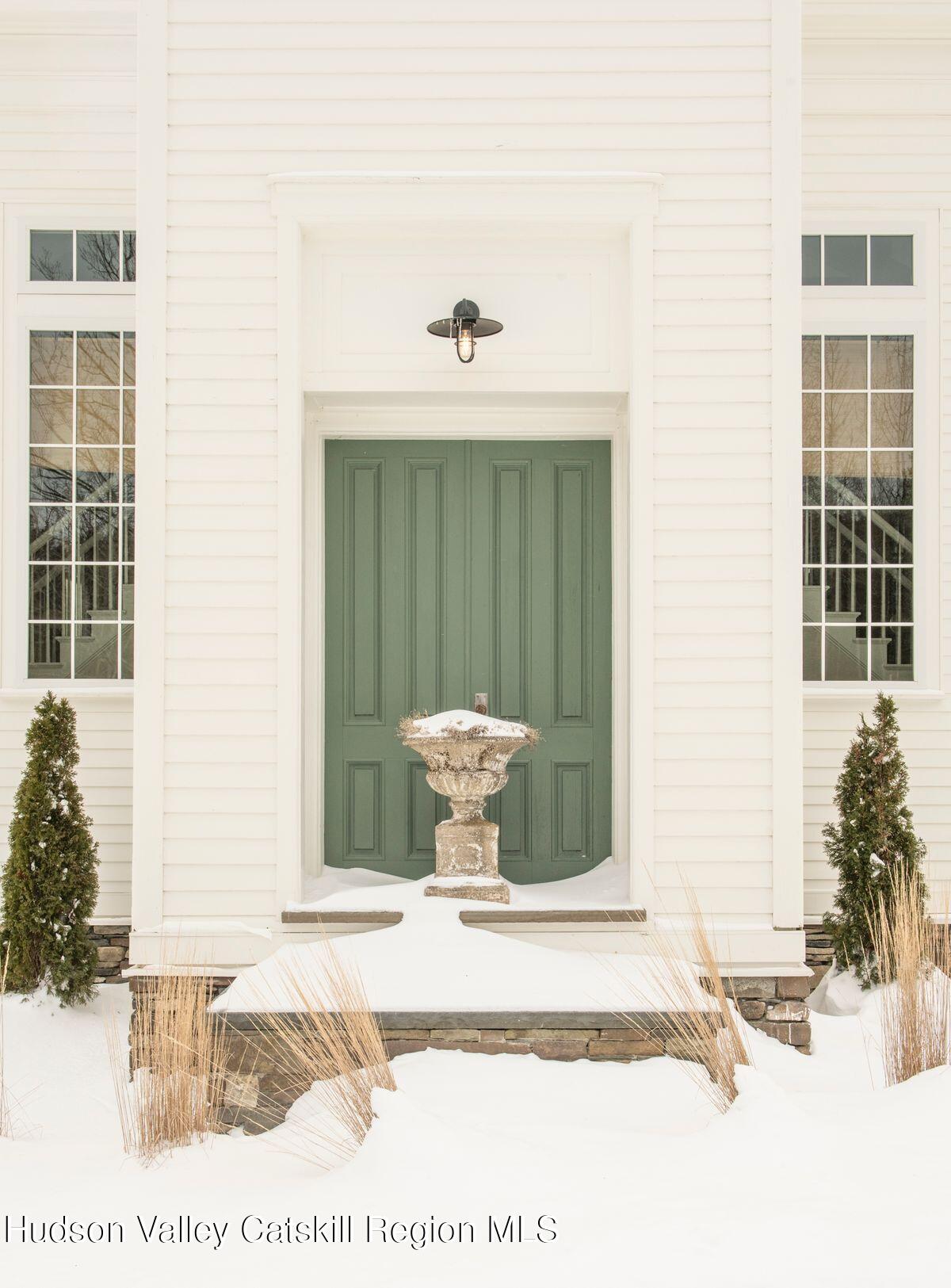 1174 Potter Mountain Road Gilboa, NY 12076 - Photo 2 of 33 a view of a door and chair in wooden floor