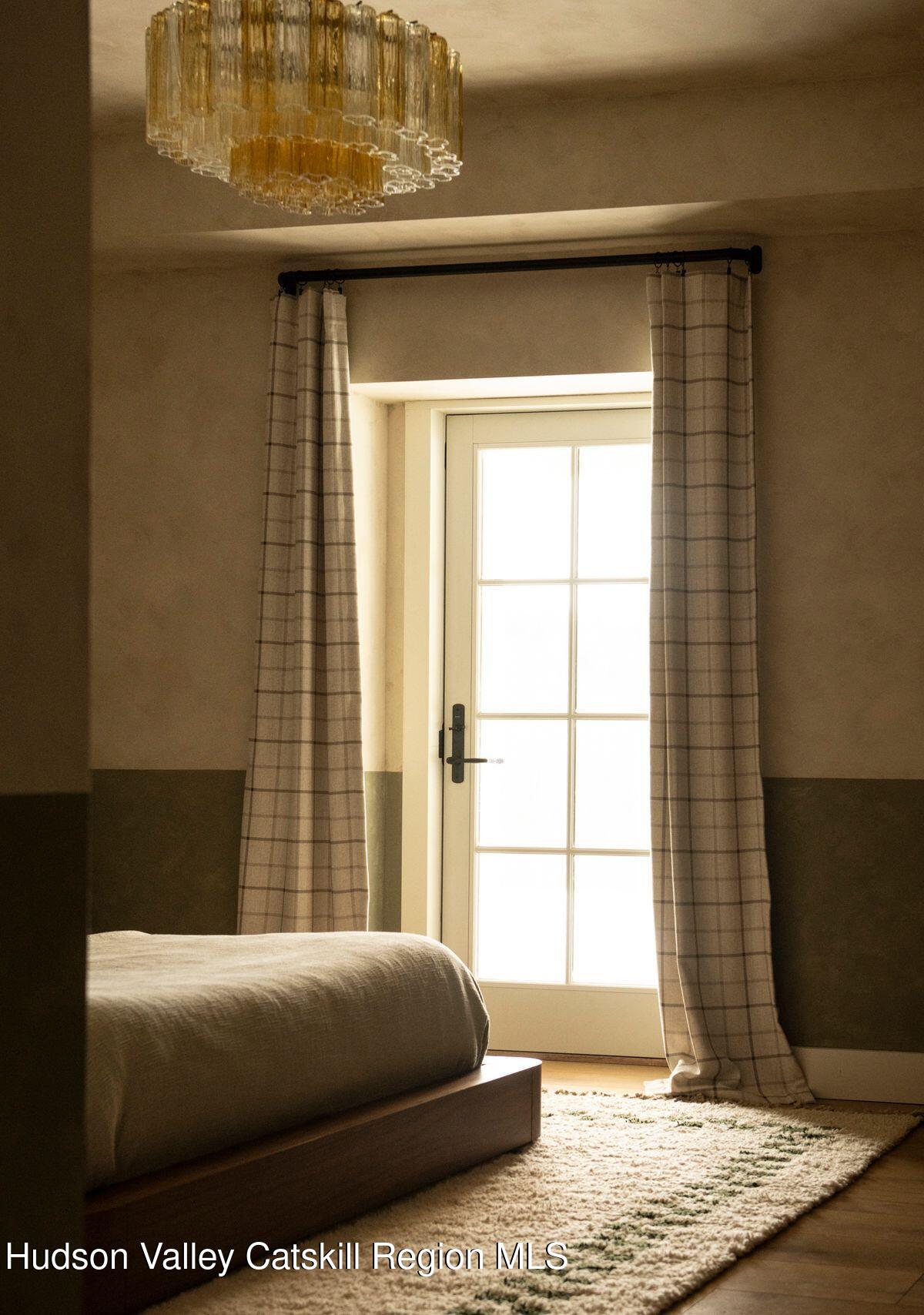 1174 Potter Mountain Road Gilboa, NY 12076 - Photo 22 of 33 a bedroom with a bed and a window