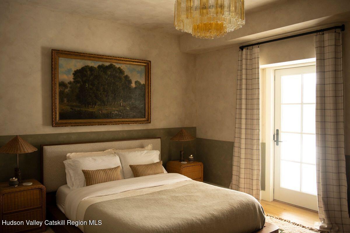 1174 Potter Mountain Road Gilboa, NY 12076 - Photo 22 of 33 a bedroom with a bed and a window