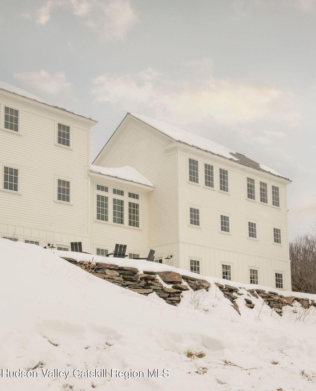1174 Potter Mountain Road Gilboa, NY 12076 - Photo 31 of 33 a view of a bedroom with a bed and cabinets