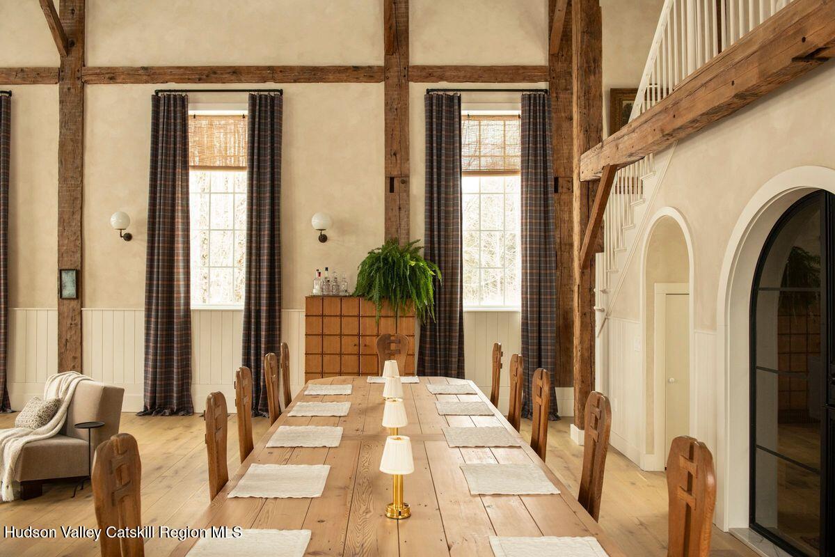 1174 Potter Mountain Road Gilboa, NY 12076 - Photo 9 of 33 a bedroom with large window and a bed