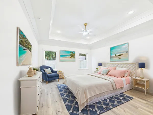 a bedroom with a bed and a chandelier