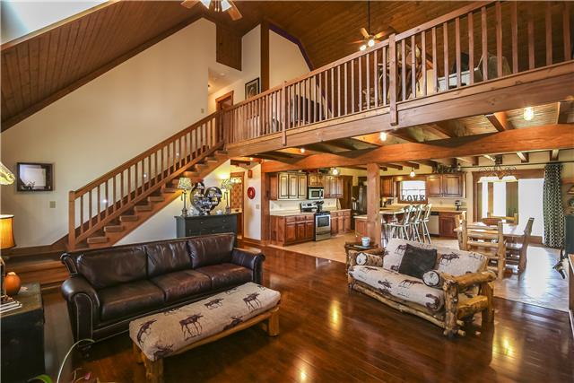4360 North Pinson Road Portland, TN 37148 - Photo 2 of 20 Another view of living room showcasing the staircase up to the loft family area. Notice the detail in the wood ceiling.