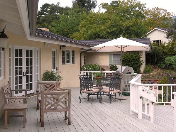 1379 School House Road Montecito, CA 93108 - Photo 5 of 11 a patio with wooden floor a yard a table and chairs