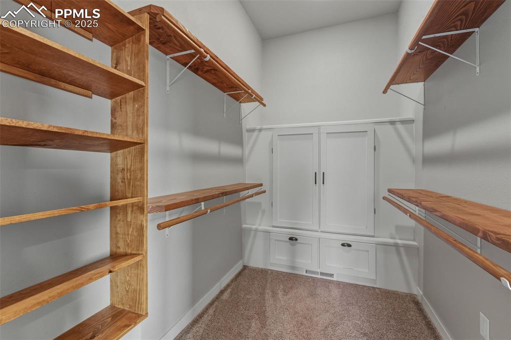 16750 Rabbit Track Trail Colorado Springs, CO 80930 - Photo 19 of 50 Primary Bedroom Walk in Closet.