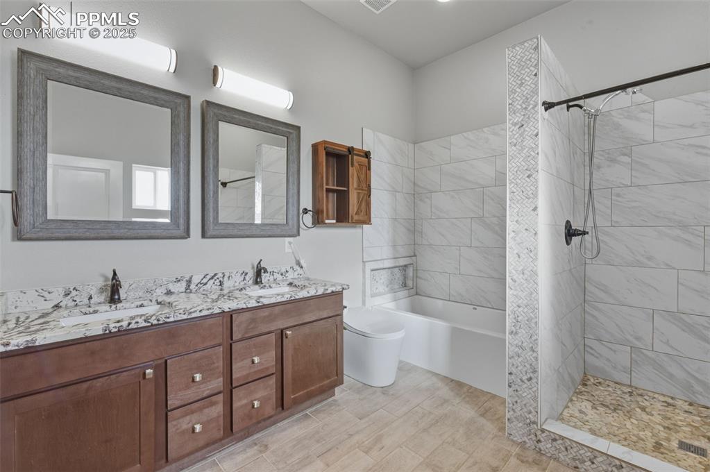 16750 Rabbit Track Trail Colorado Springs, CO 80930 - Photo 20 of 50 Luxury smart toilet featuring an automatic lid that opens as you approach, heated seat, built-in bidet with adjustable wash and warm-air dryer, self-cleaning functions, and hands-free automatic flushing. Designed for maximum comfort, hygiene, and convenience.