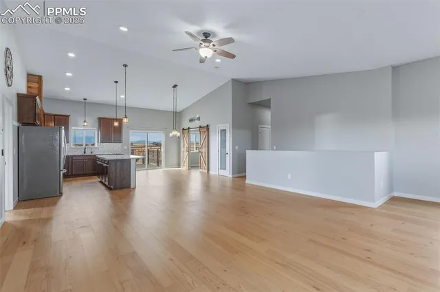 a view of kitchen with furniture and wooden floor