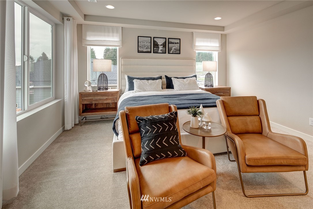 118 215th Street Southeast, Unit 8 Bothell, WA 98021 - Photo 14 of 21 a bedroom with furniture and a large window