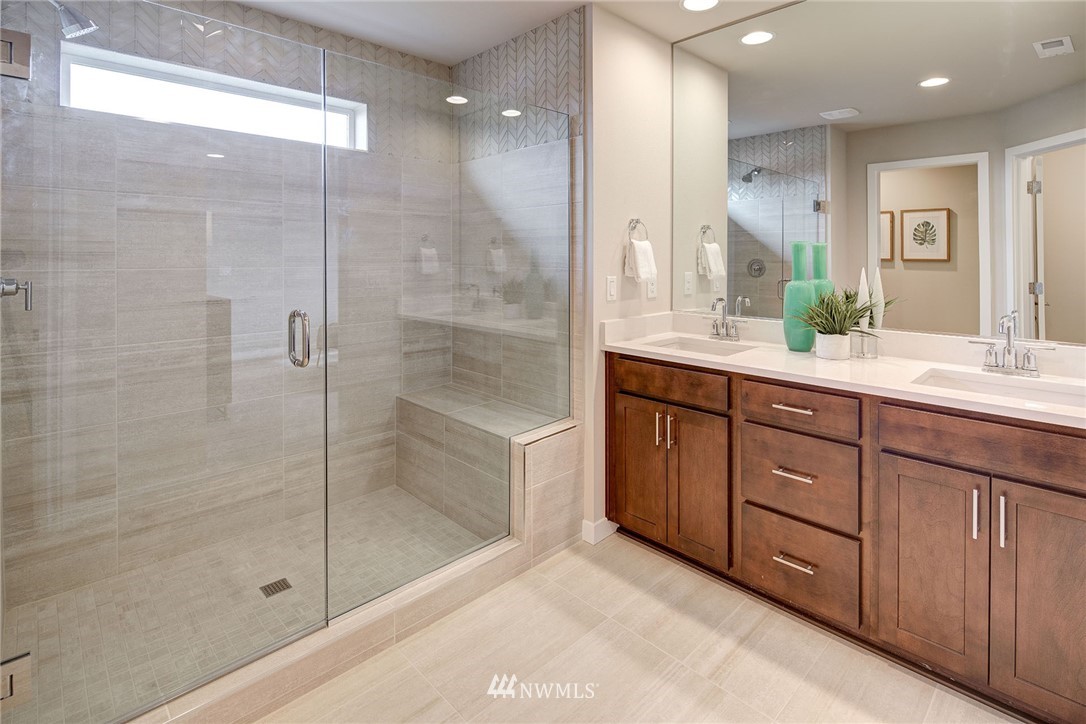 118 215th Street Southeast, Unit 8 Bothell, WA 98021 - Photo 15 of 21 a bathroom with a granite countertop sink mirror and shower