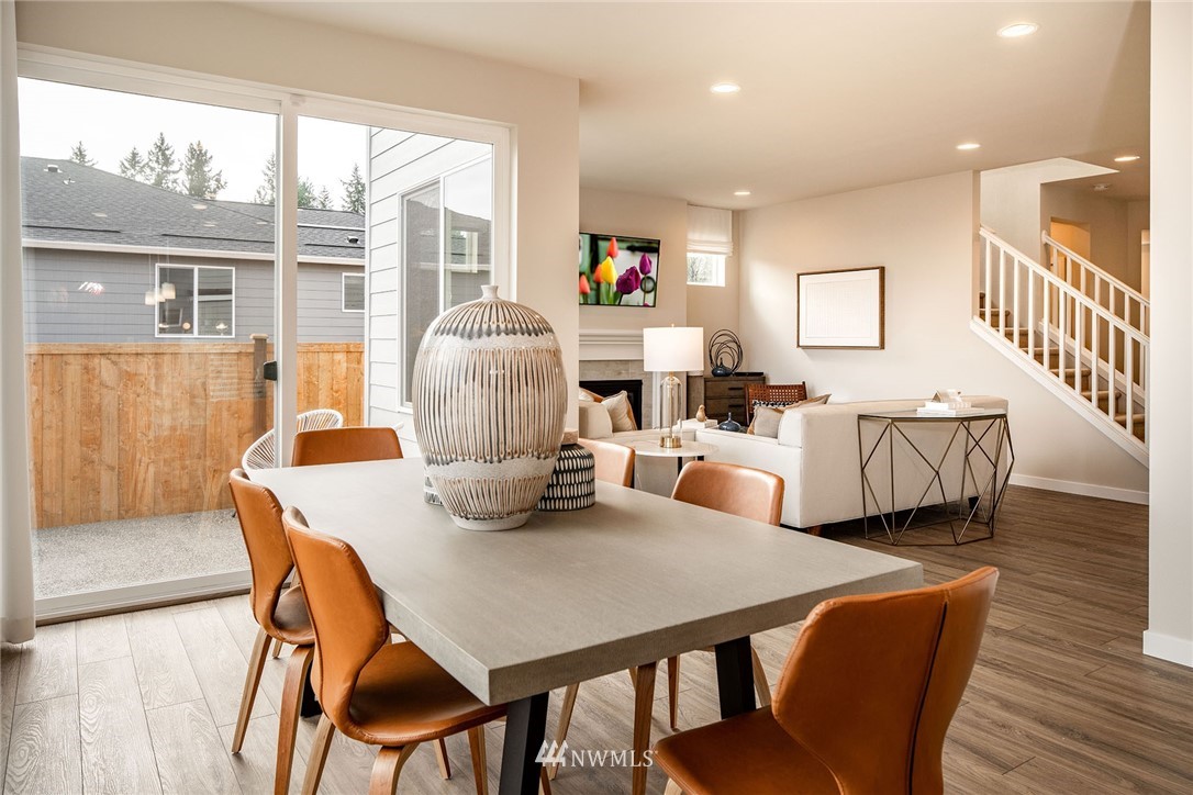 118 215th Street Southeast, Unit 8 Bothell, WA 98021 - Photo 7 of 21 a living room with furniture and a table