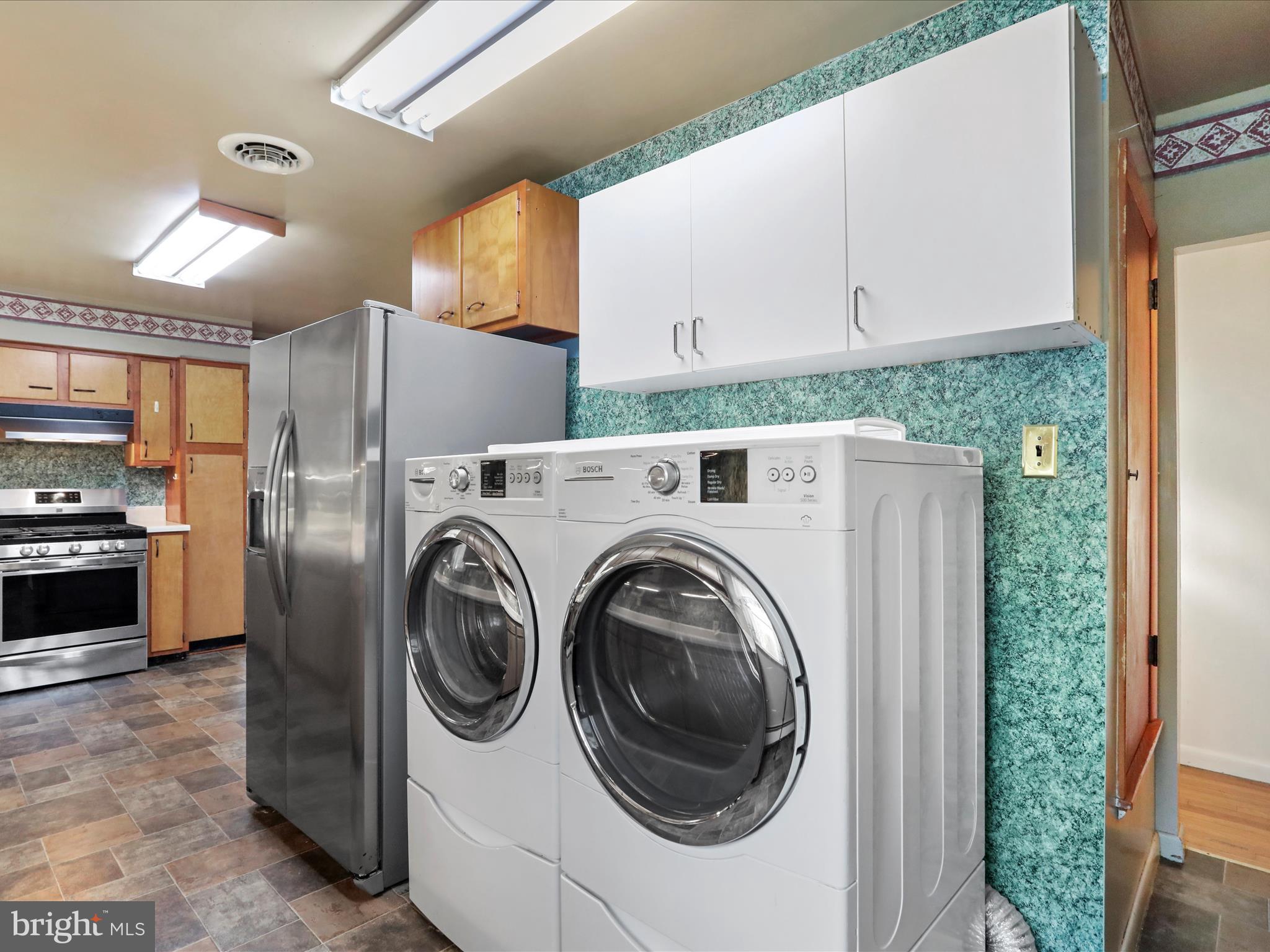 60 Grey Spring Avenue Bunker Hill, WV 25413 - Photo 12 of 35 a utility room with dryer and washer