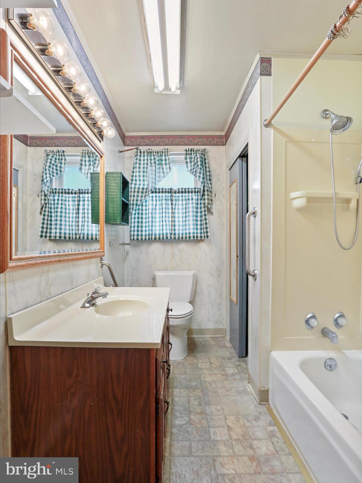 60 Grey Spring Avenue Bunker Hill, WV 25413 - Photo 16 of 35 a bathroom with a sink a toilet and shower
