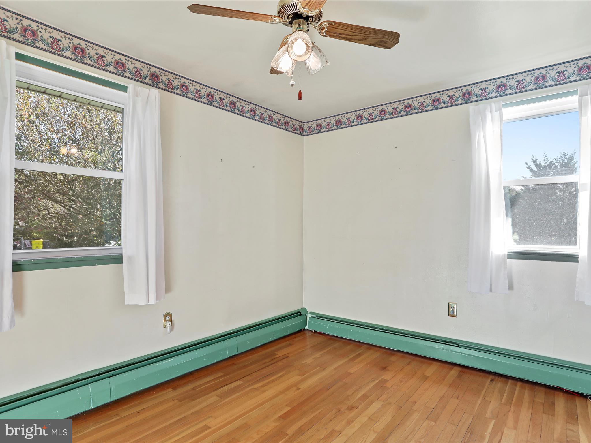 60 Grey Spring Avenue Bunker Hill, WV 25413 - Photo 19 of 35 a view of a room with wooden floor and fan