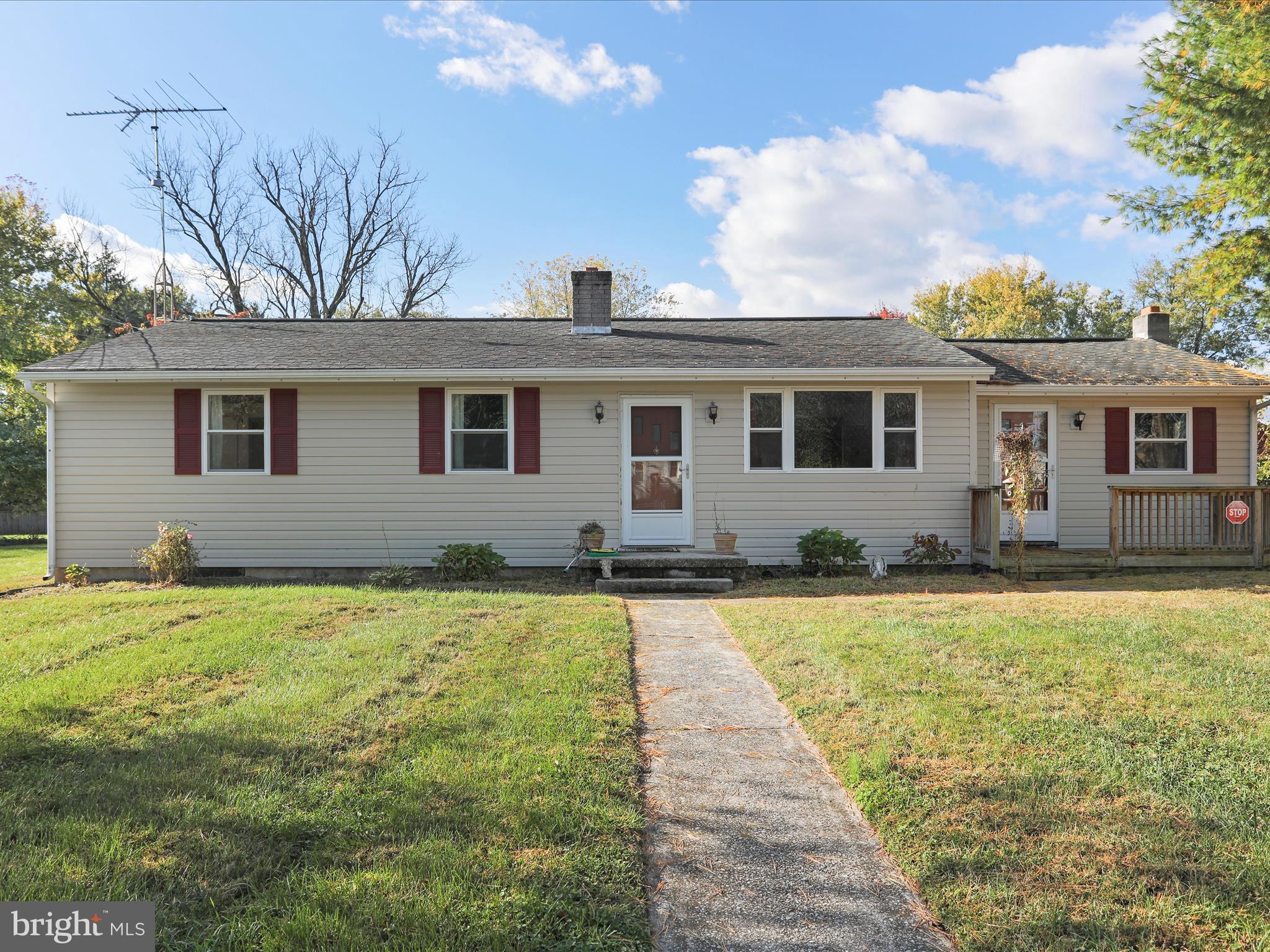 60 Grey Spring Avenue Bunker Hill, WV 25413 - Photo 2 of 35 a front view of a house with yard