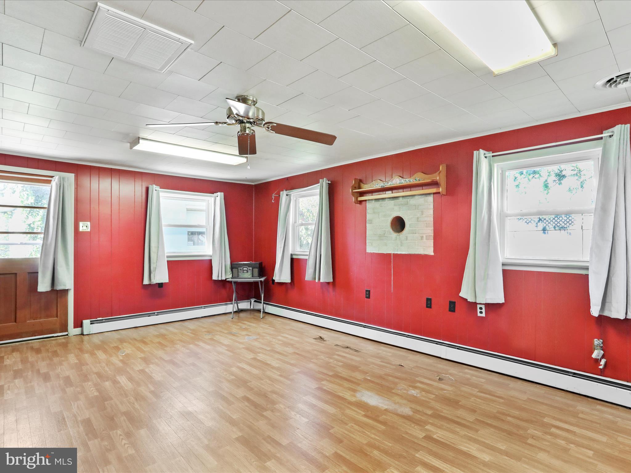 60 Grey Spring Avenue Bunker Hill, WV 25413 - Photo 21 of 35 an empty room with windows and closet