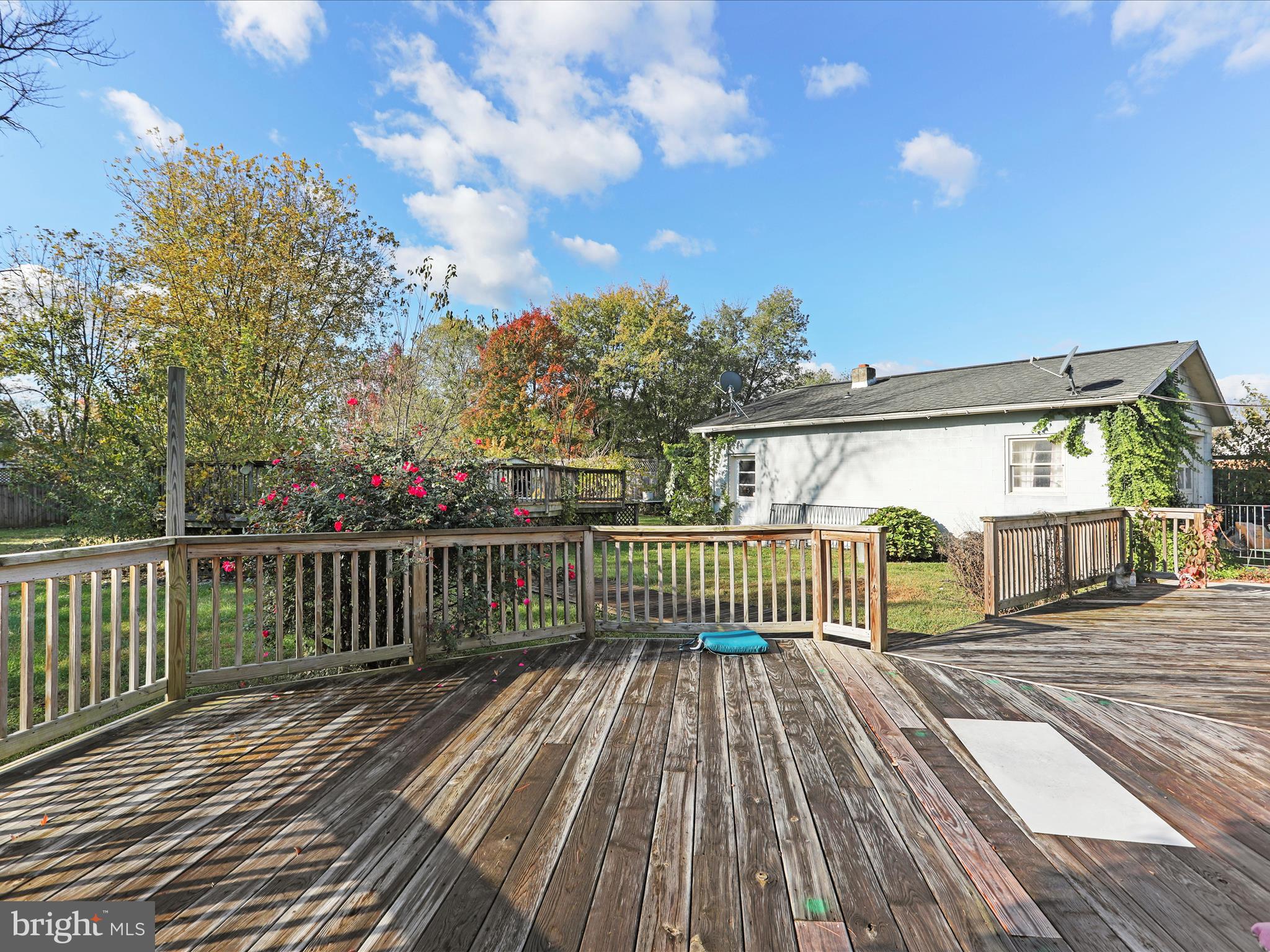60 Grey Spring Avenue Bunker Hill, WV 25413 - Photo 27 of 35 a view of a wooden deck with a yard