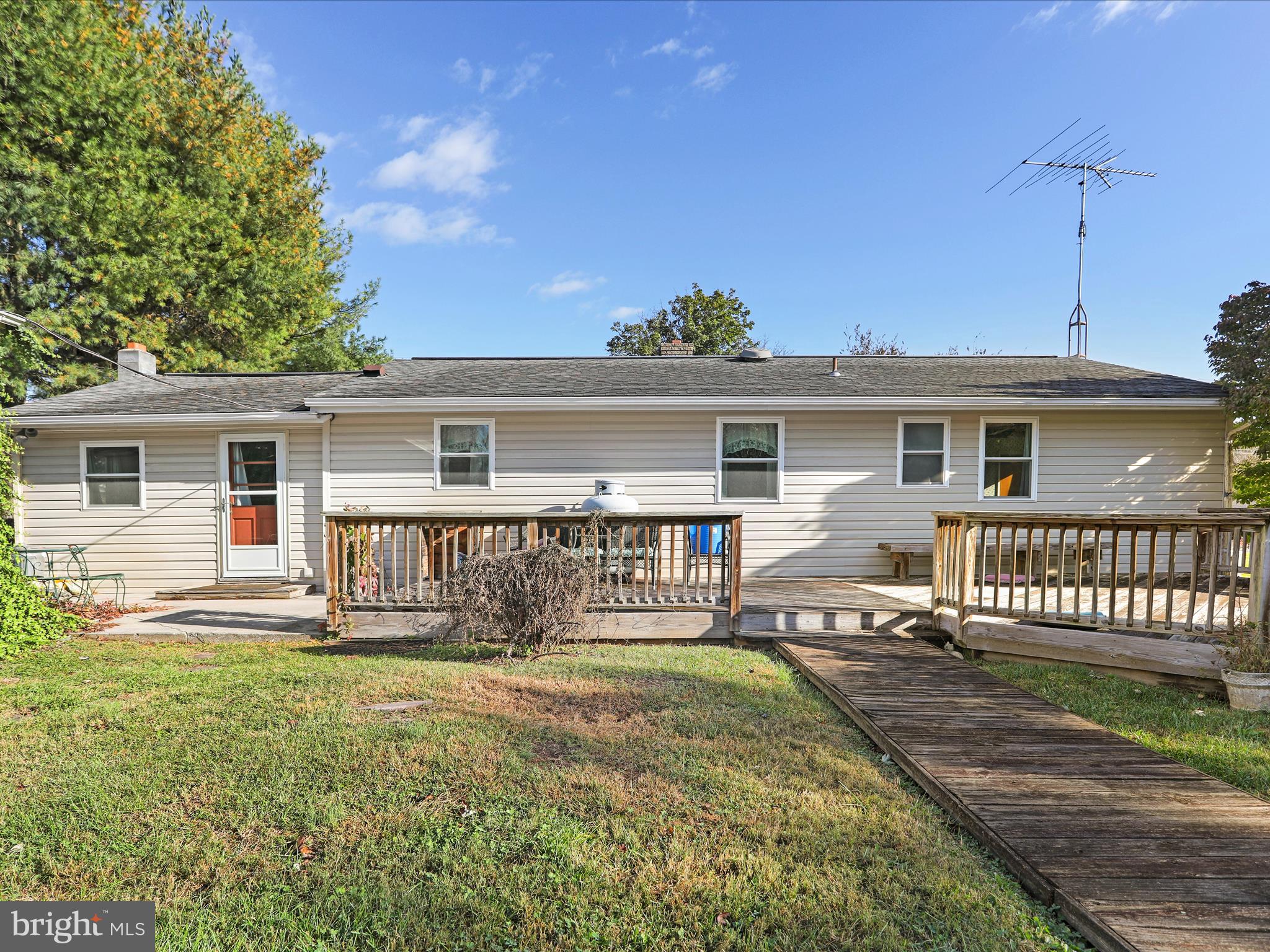 60 Grey Spring Avenue Bunker Hill, WV 25413 - Photo 29 of 35 a front view of a house with a yard