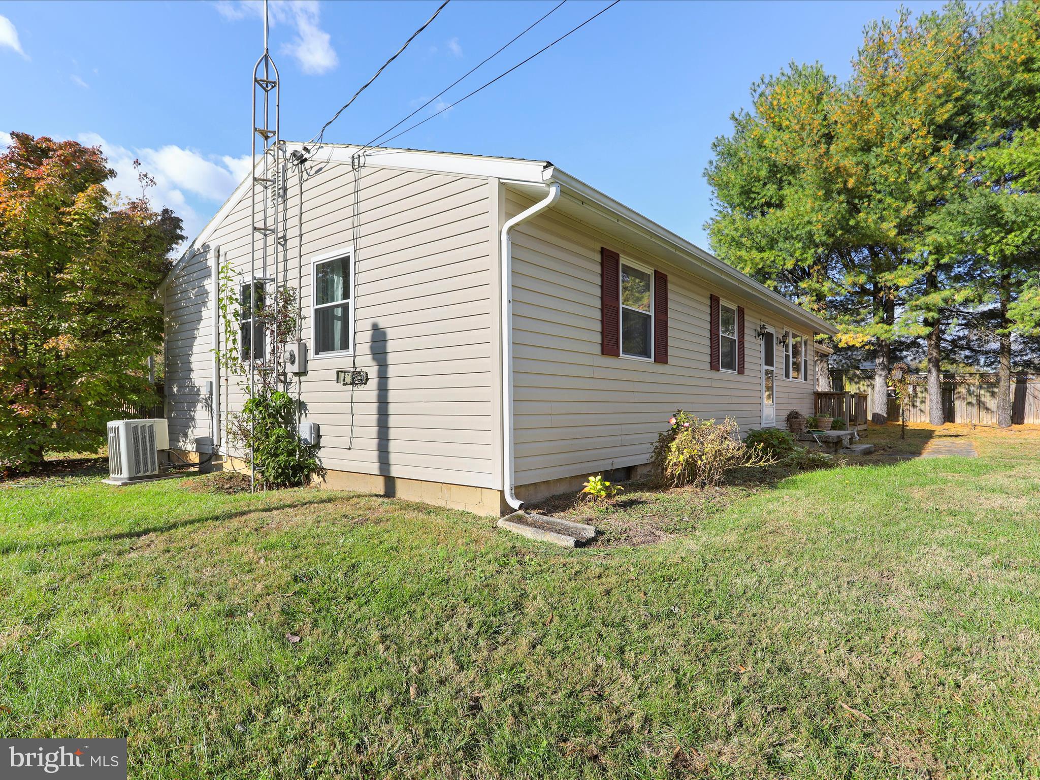 60 Grey Spring Avenue Bunker Hill, WV 25413 - Photo 32 of 35 a backyard of a house with table and chairs