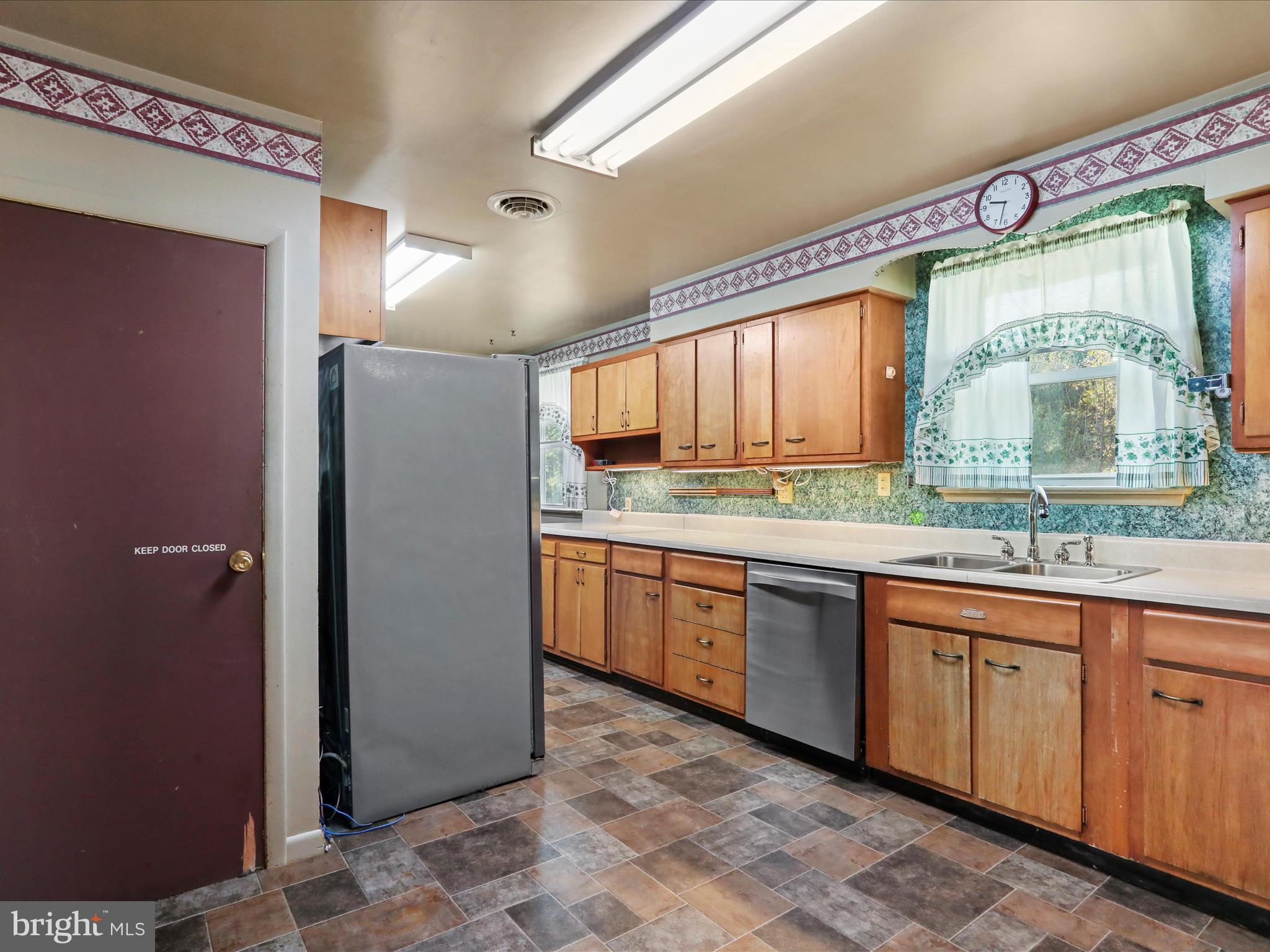 60 Grey Spring Avenue Bunker Hill, WV 25413 - Photo 8 of 35 a large kitchen with a sink and cabinets