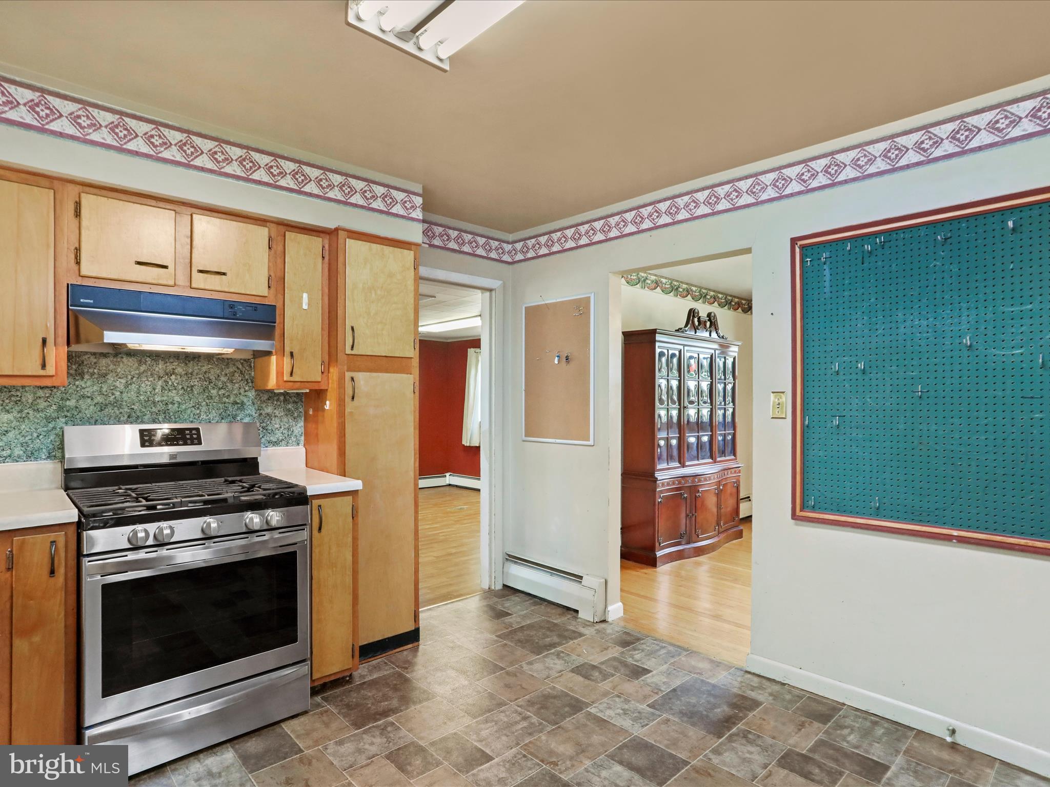 60 Grey Spring Avenue Bunker Hill, WV 25413 - Photo 10 of 35 a kitchen with a stove and a refrigerator