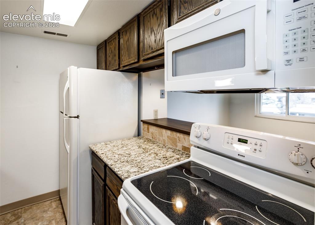 1034 Fontmore Road, Unit D Colorado Springs, CO 80904 - Photo 19 of 43 a utility room with dryer and washer