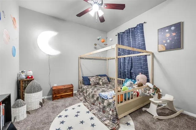 a bedroom with furniture and a chandelier