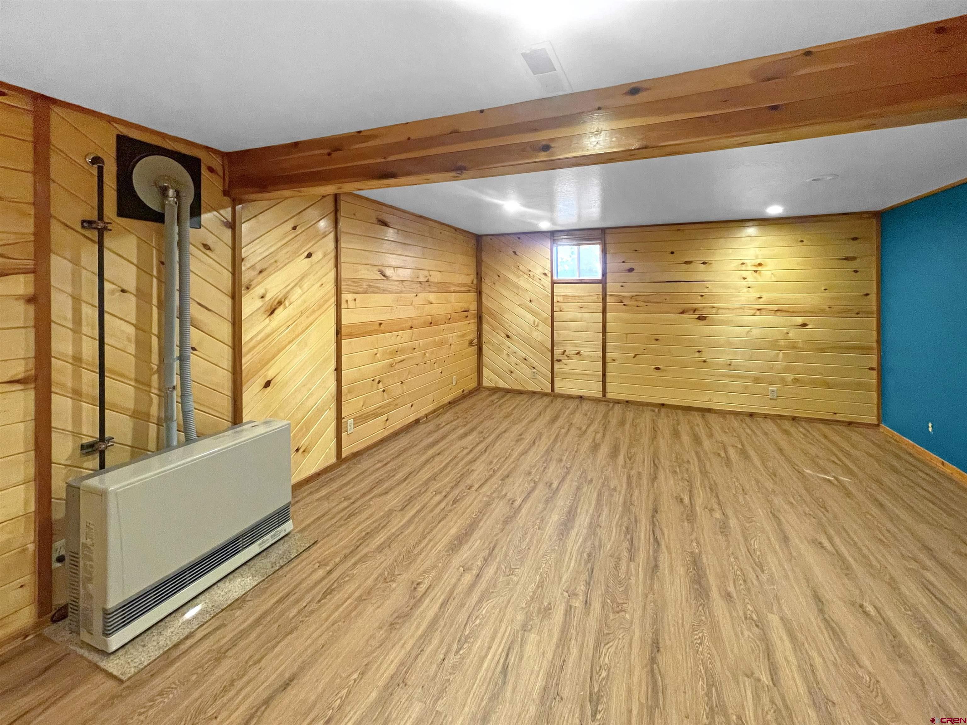 16 West 10th Street Cortez, CO 81321 - Photo 16 of 18 a view of a room with wooden floor and door