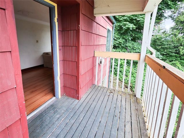 a view of balcony with wooden floor