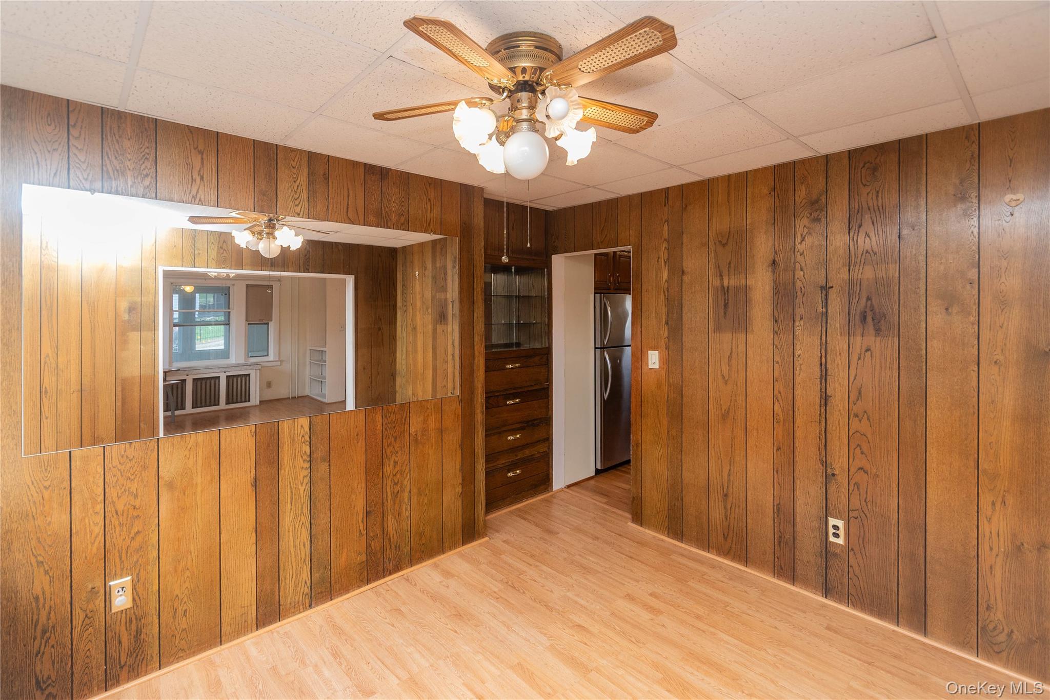 200 Husted Avenue Peekskill, NY 10566 - Photo 22 of 50 a bedroom with a bed and a chandelier