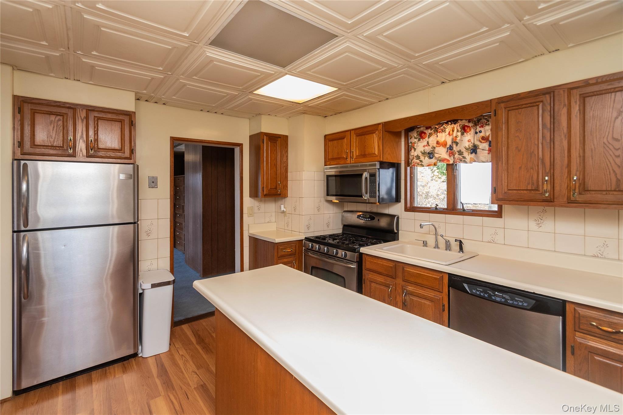 200 Husted Avenue Peekskill, NY 10566 - Photo 24 of 50 a kitchen with stainless steel appliances a refrigerator sink and microwave