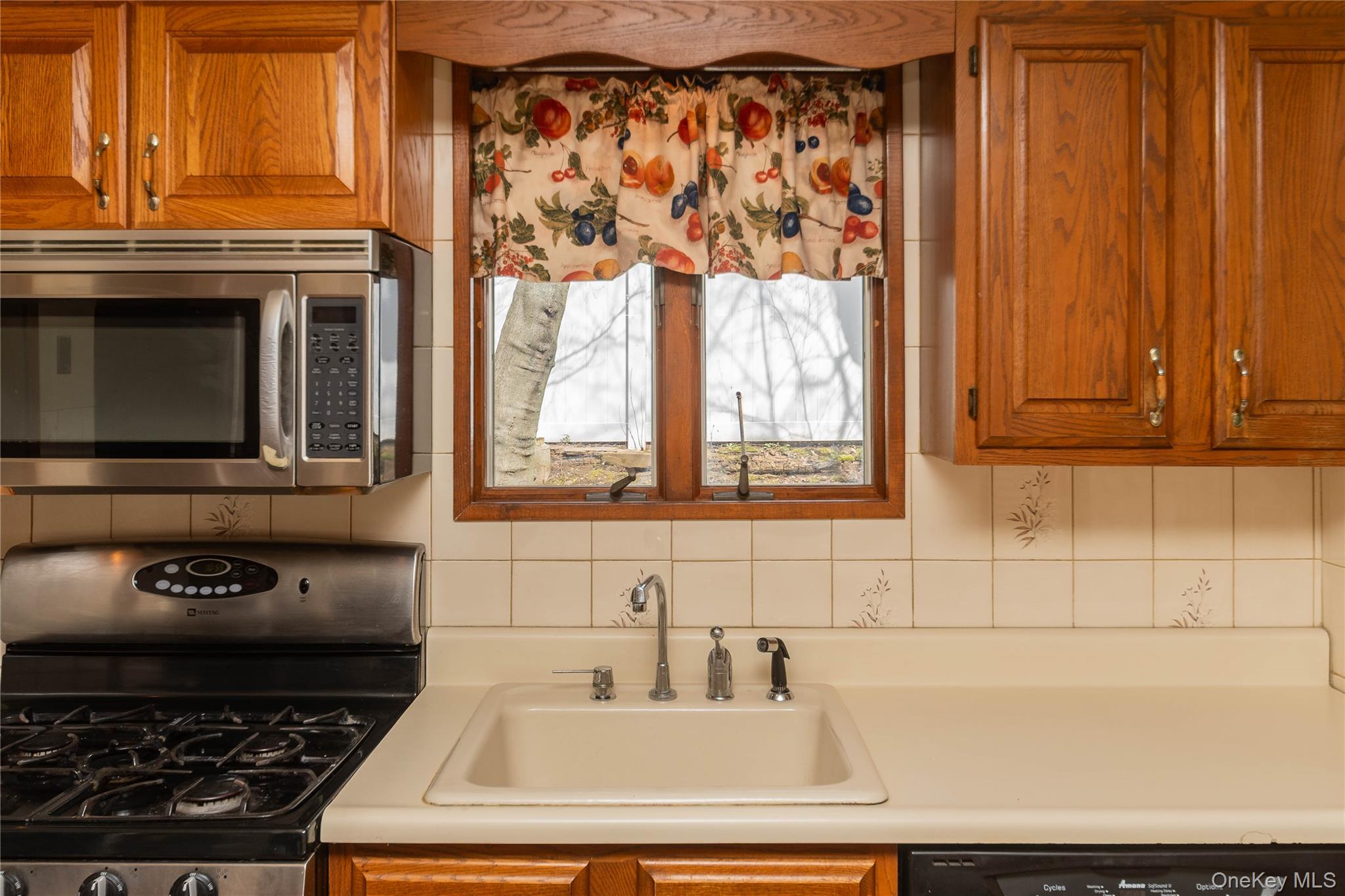 200 Husted Avenue Peekskill, NY 10566 - Photo 25 of 50 a bathroom with a granite countertop sink and large window