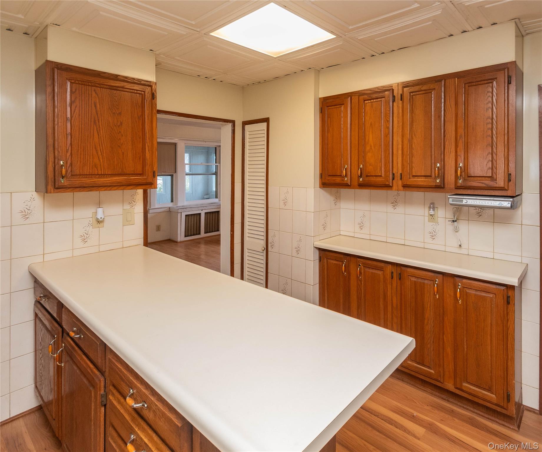 200 Husted Avenue Peekskill, NY 10566 - Photo 26 of 50 a kitchen with a sink cabinets and wooden floor