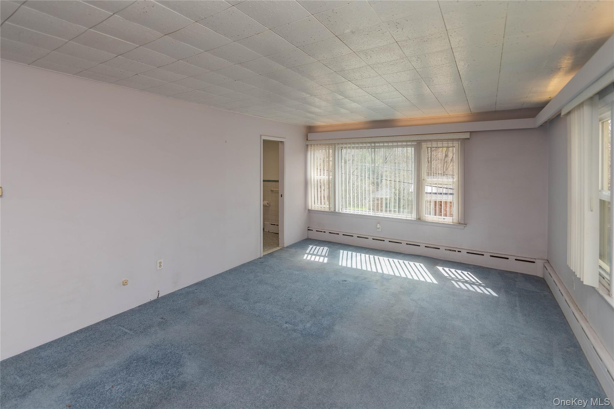 200 Husted Avenue Peekskill, NY 10566 - Photo 34 of 50 an empty room with a empty space and windows