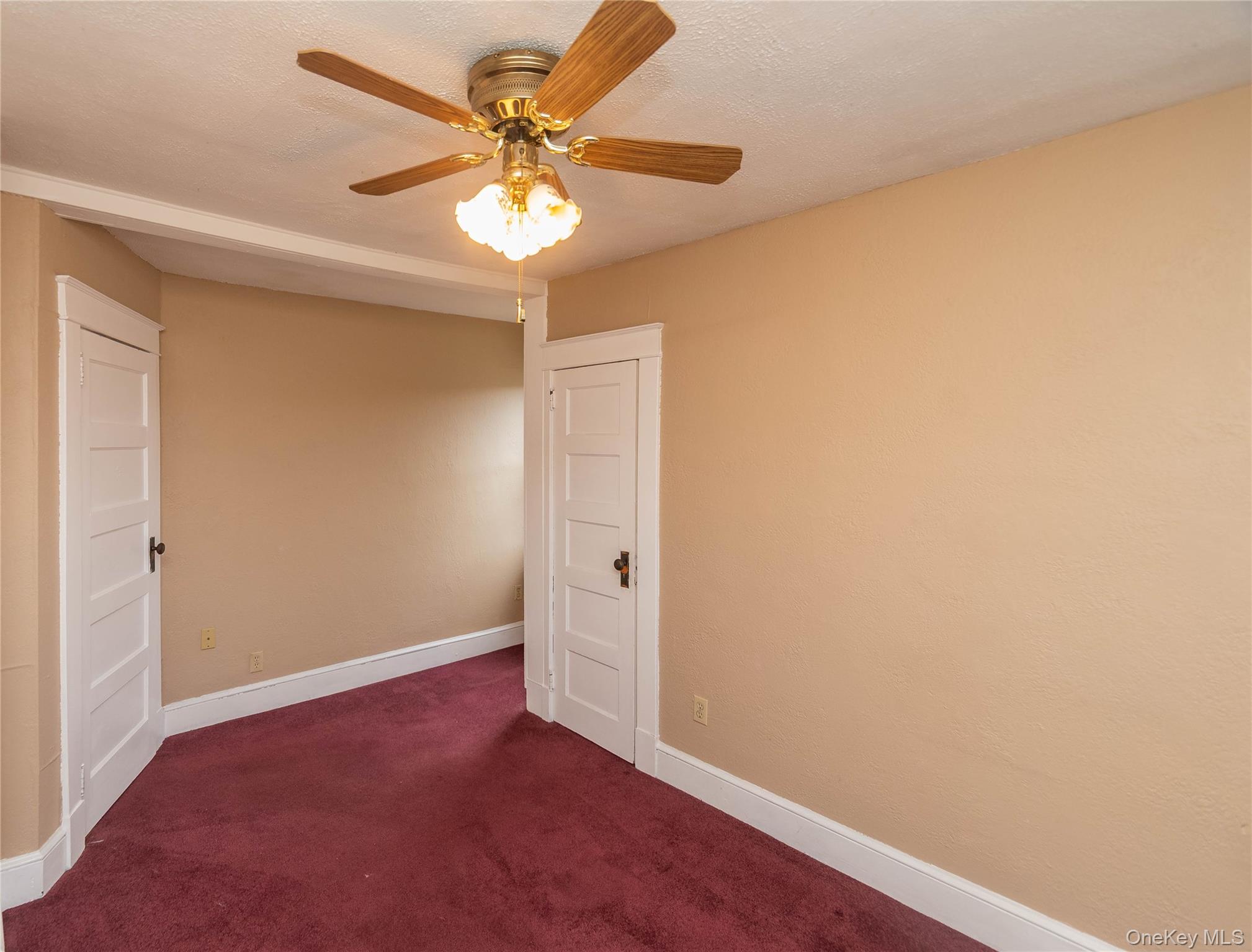 200 Husted Avenue Peekskill, NY 10566 - Photo 36 of 50 an empty room with a chandelier fan and windows