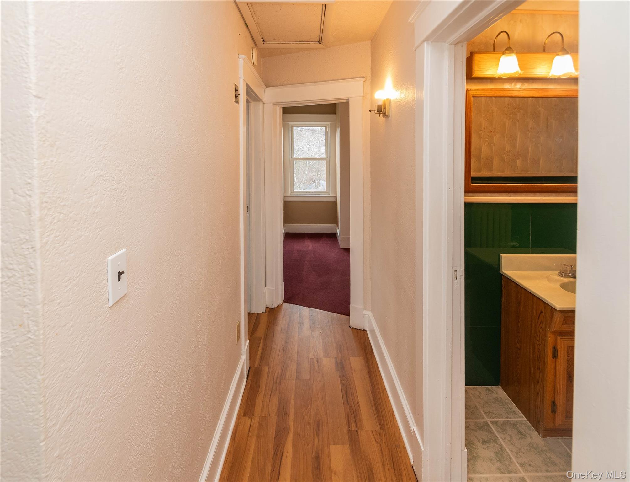 200 Husted Avenue Peekskill, NY 10566 - Photo 37 of 50 a view of a hallway with wooden floor and a bathroom