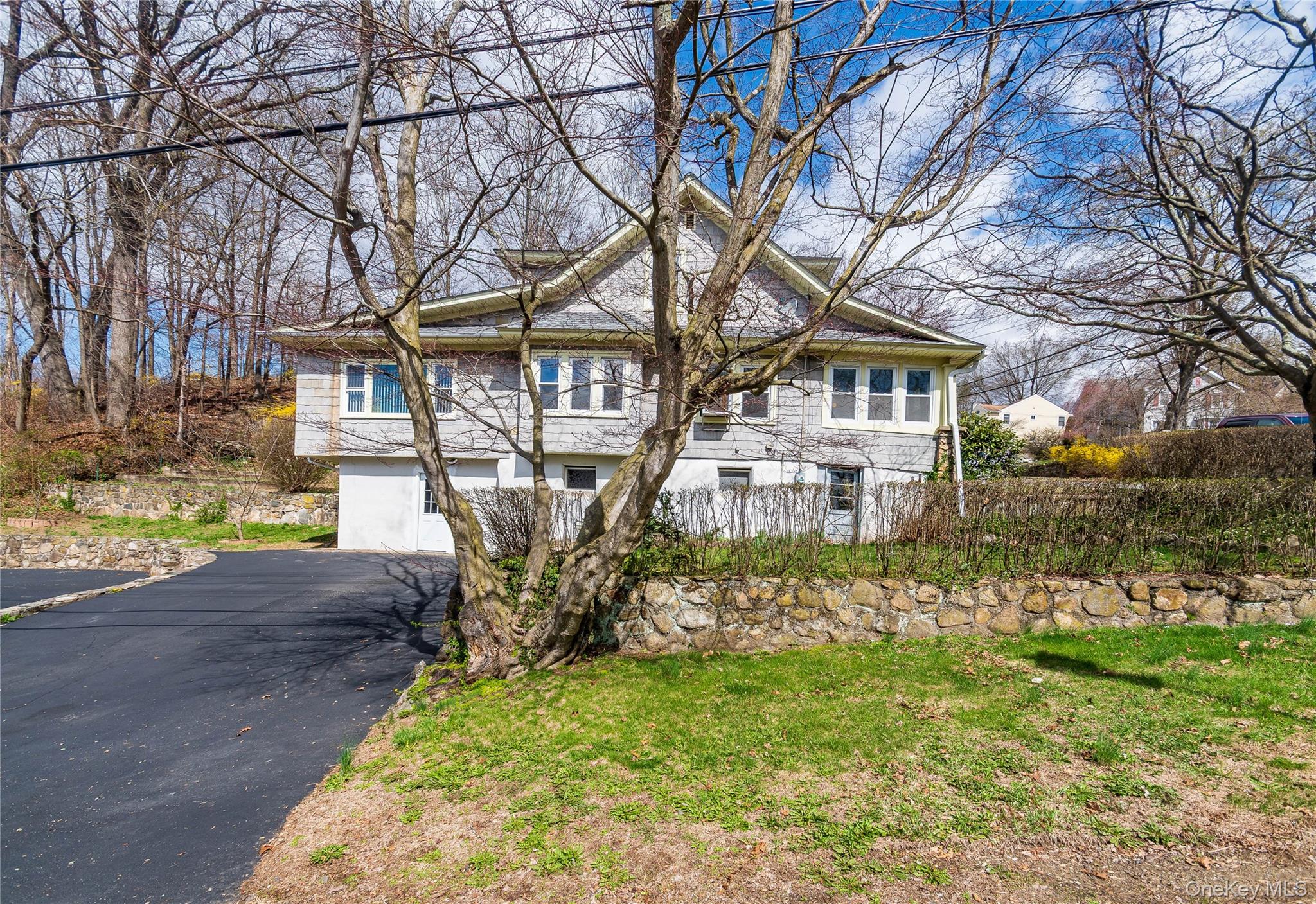 200 Husted Avenue Peekskill, NY 10566 - Photo 4 of 50 a front view of a house with a yard