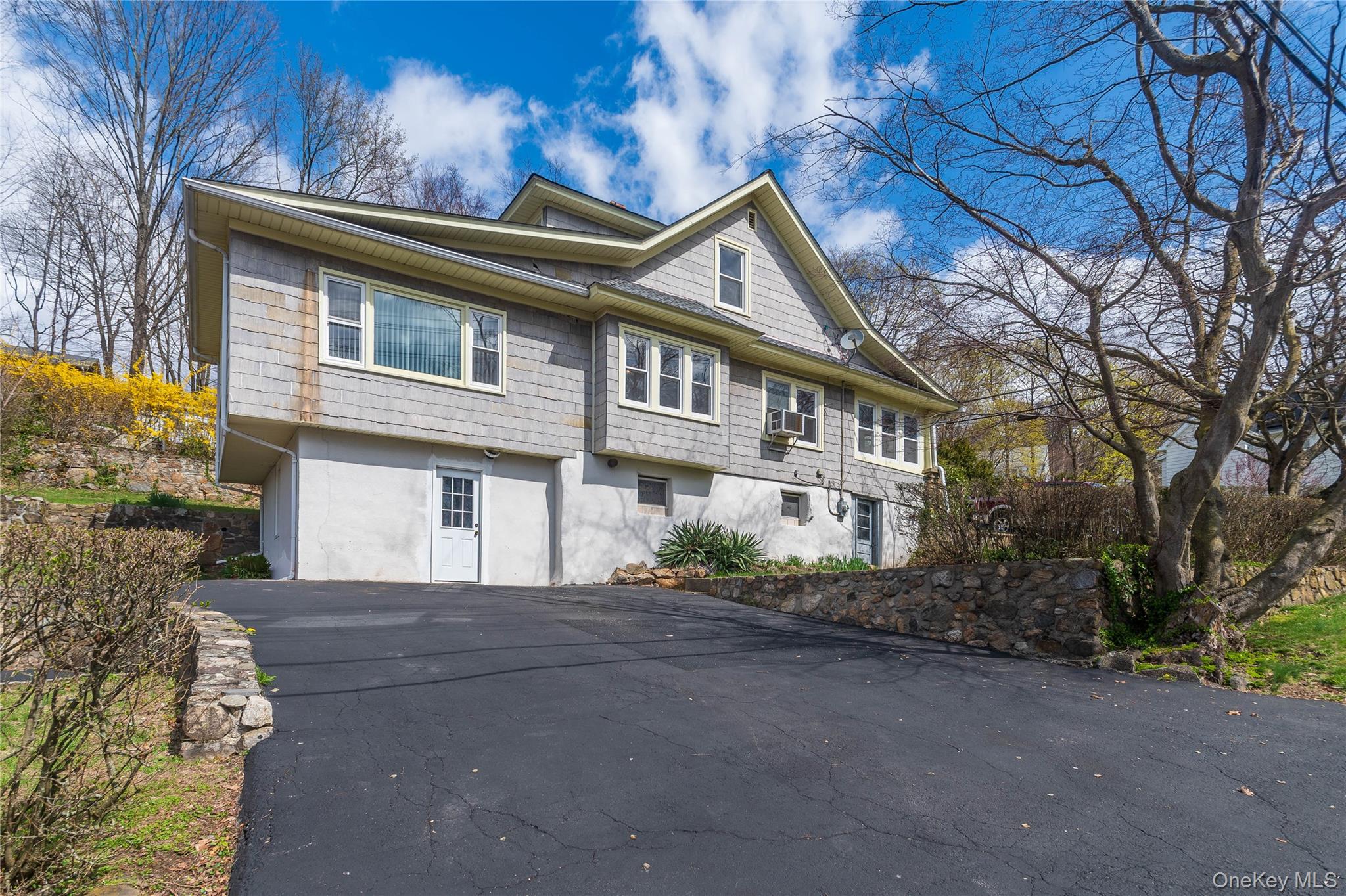 200 Husted Avenue Peekskill, NY 10566 - Photo 8 of 50 a front view of a house with a garden