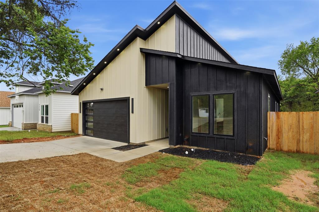 1111 Riverwood Road Dallas, TX 75217 - Photo 6 of 40 Contemporary exterior featuring vertical siding in contrasting dark and light tones
