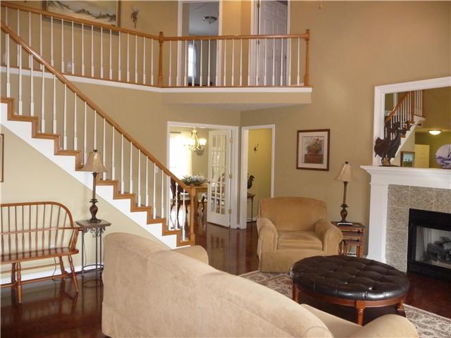 1250 Walter Head Road Adams, TN 37010 - Photo 2 of 20 a living room with furniture fireplace and baby crib