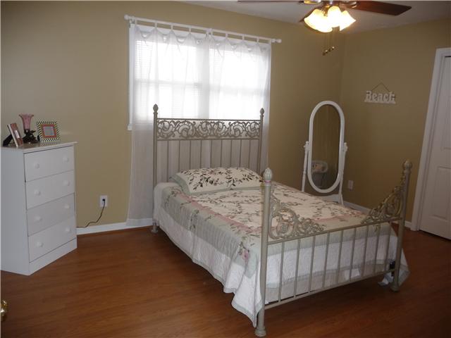 1250 Walter Head Road Adams, TN 37010 - Photo 14 of 20 a bed sitting in a bedroom next to a window