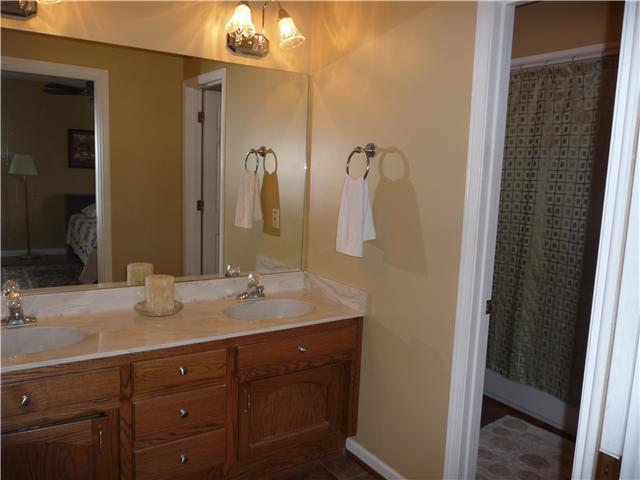 1250 Walter Head Road Adams, TN 37010 - Photo 15 of 20 a bathroom with a granite countertop sink and a mirror