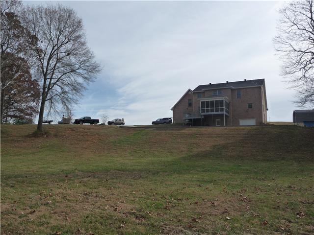 1250 Walter Head Road Adams, TN 37010 - Photo 19 of 20 a view of a houses with yard and lake view
