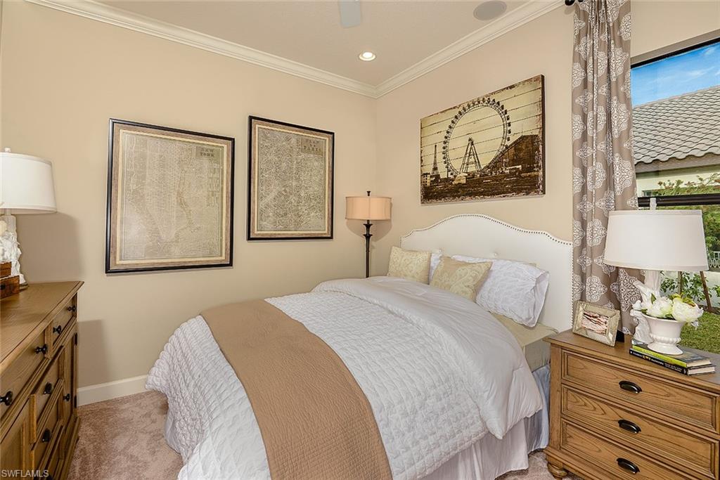 8558 Maggiore Court Naples, FL 34114 - Photo 16 of 32 a bedroom with a bed and a desk