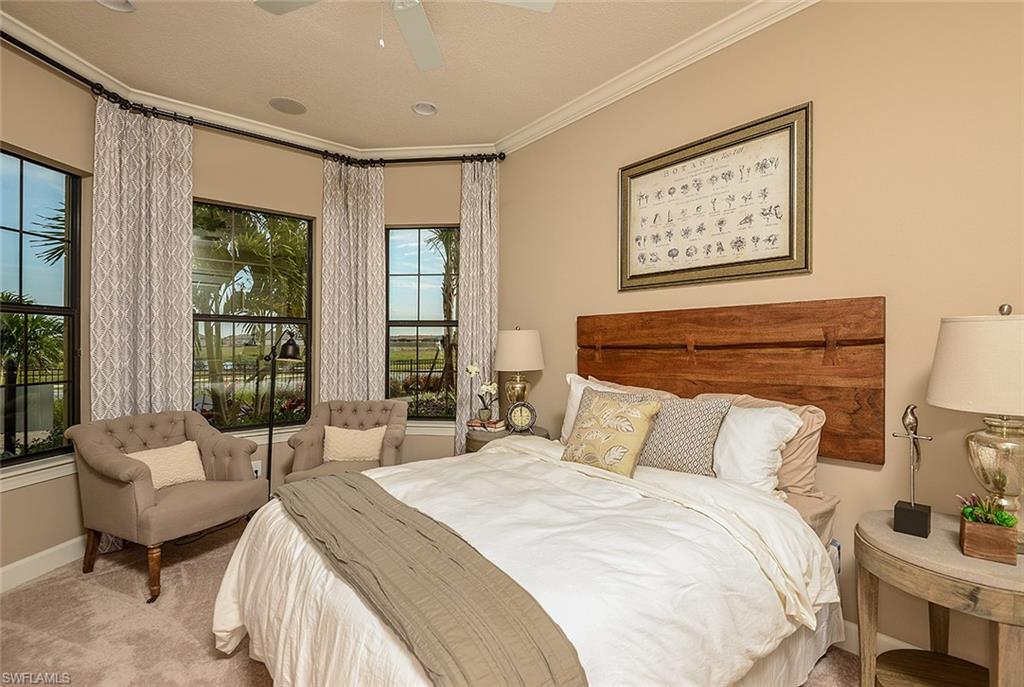 8558 Maggiore Court Naples, FL 34114 - Photo 18 of 32 a bedroom with a bed and a couch