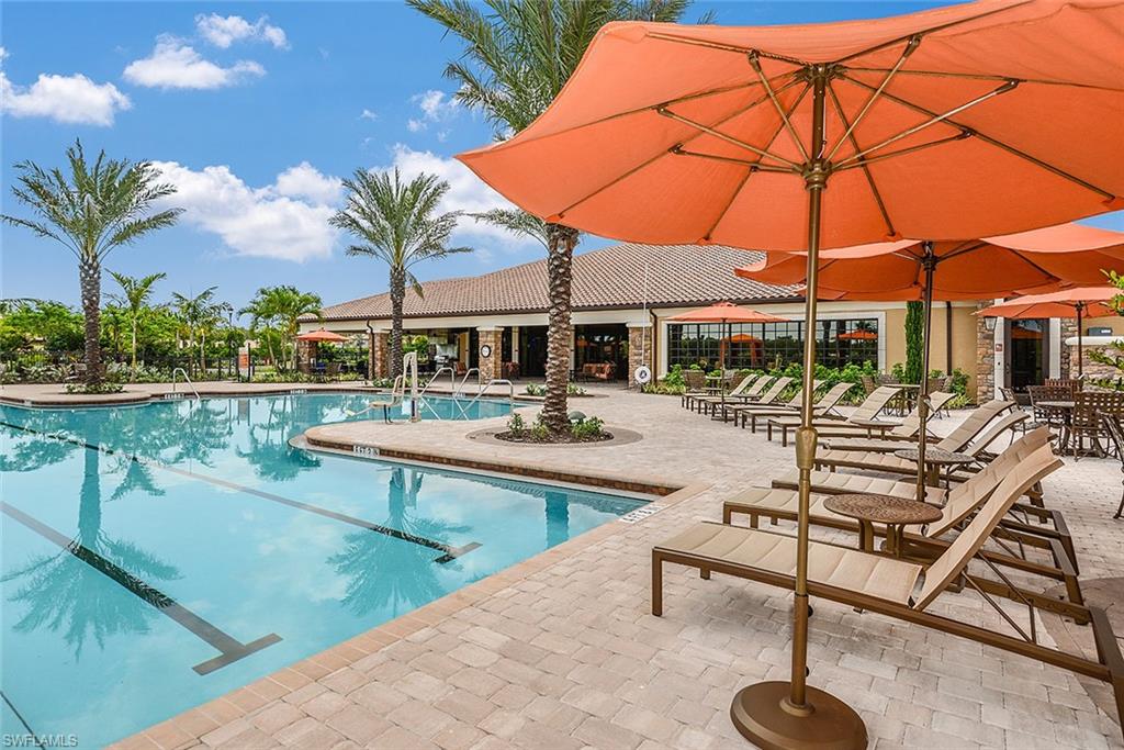 8558 Maggiore Court Naples, FL 34114 - Photo 21 of 32 a swimming pool with outdoor seating and yard