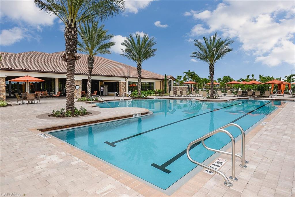 8558 Maggiore Court Naples, FL 34114 - Photo 22 of 32 a view of a backyard with swimming pool and lounge chair